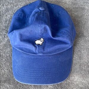 Blue cap with sheep emblem